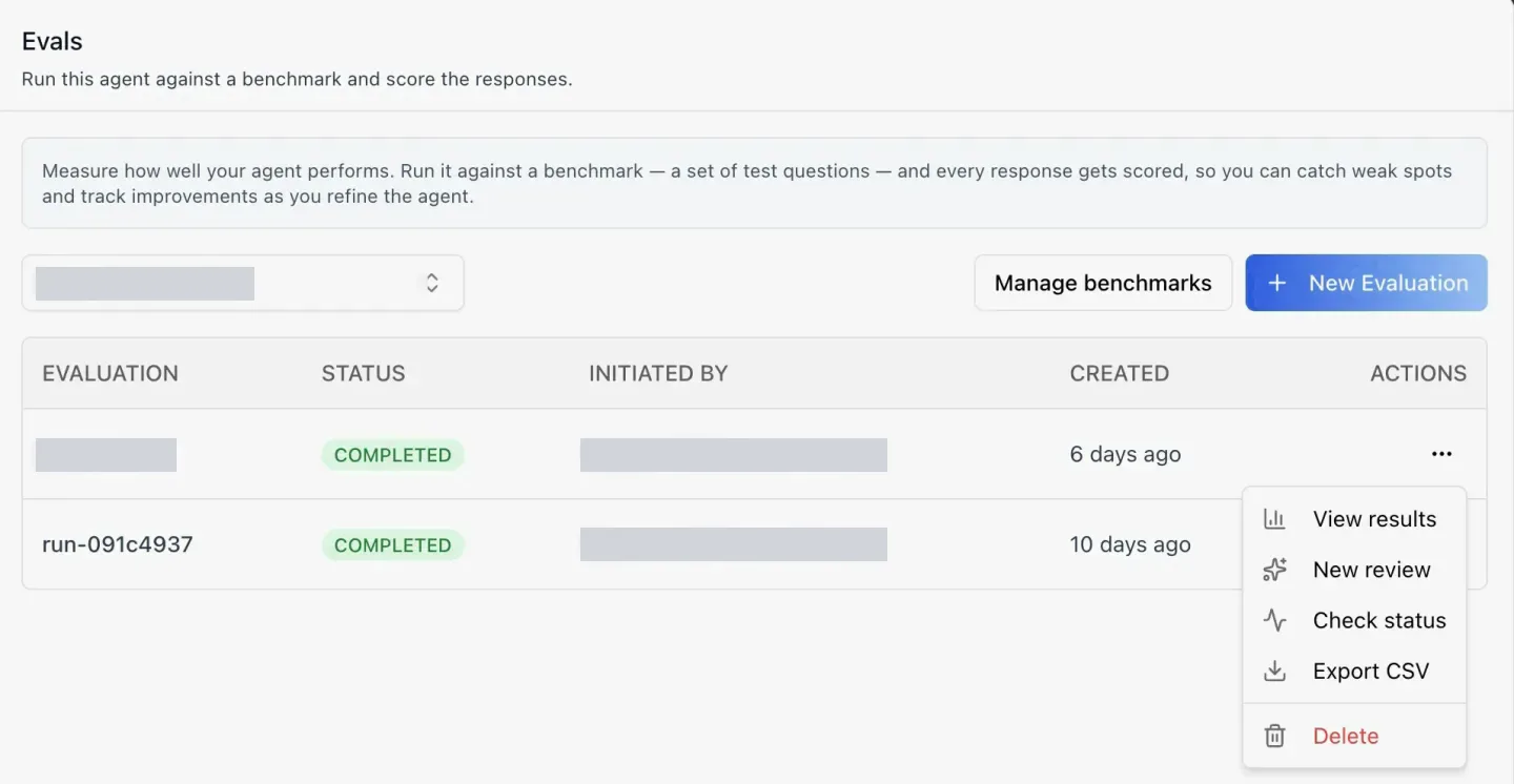 The Evals tab of an agent in ibl.ai: a benchmark selector, Manage benchmarks and New Evaluation buttons, and a table of two completed evaluation runs with Evaluation, Status, Initiated By, Created and Actions columns; the open actions menu lists View results, New review, Check status, Export CSV and Delete. The benchmark name, one run name and the initiators' emails are redacted.